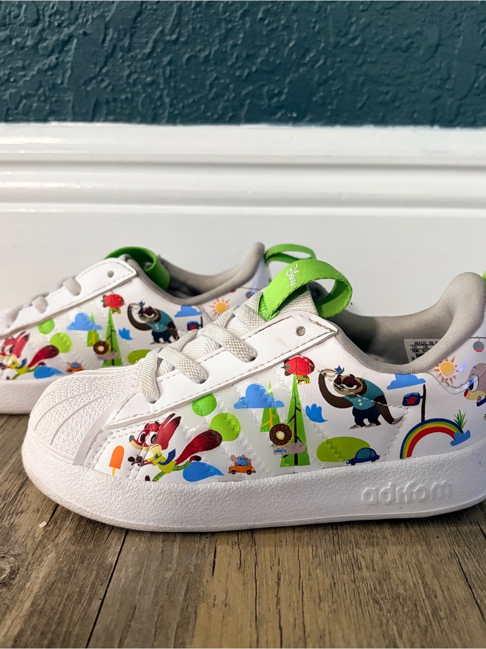 adidas Kids White Sneakers with Green Pull-Tab and Multicolor Cartoon Accents